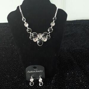 Black and crystal look necklace and matching pierced earring jewelry set.